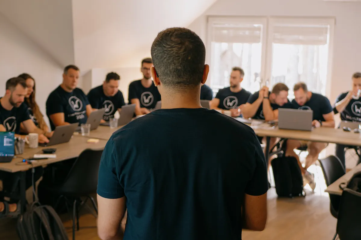 A WealthArc engineer briefing the team at the start of the hackathon