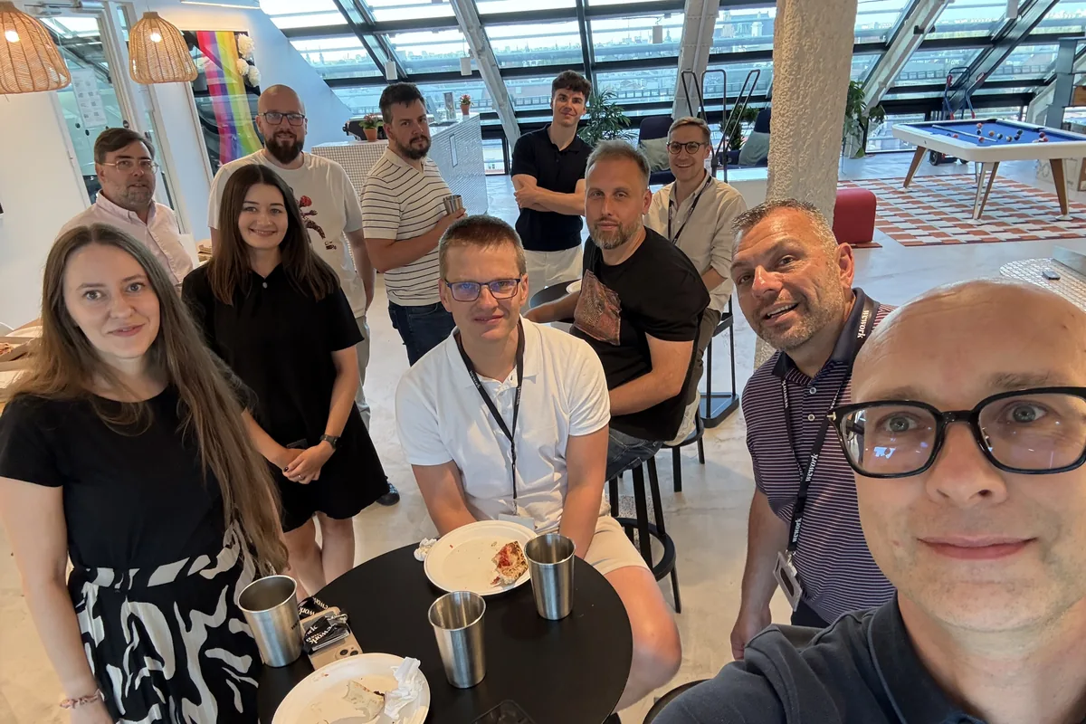 The WealthArc team together over pizza in the office lounge